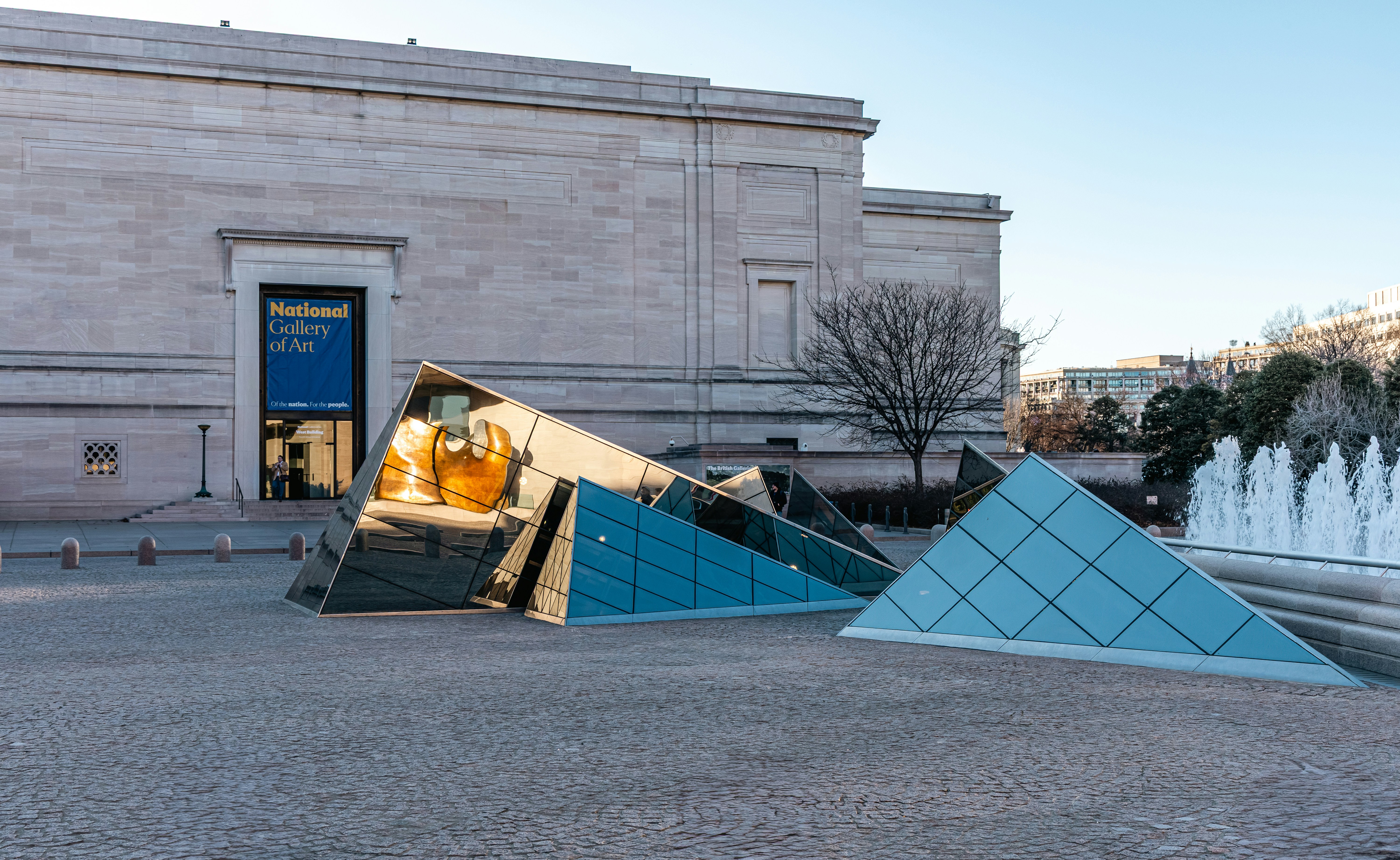 Geometric glass sculpture outside museum building