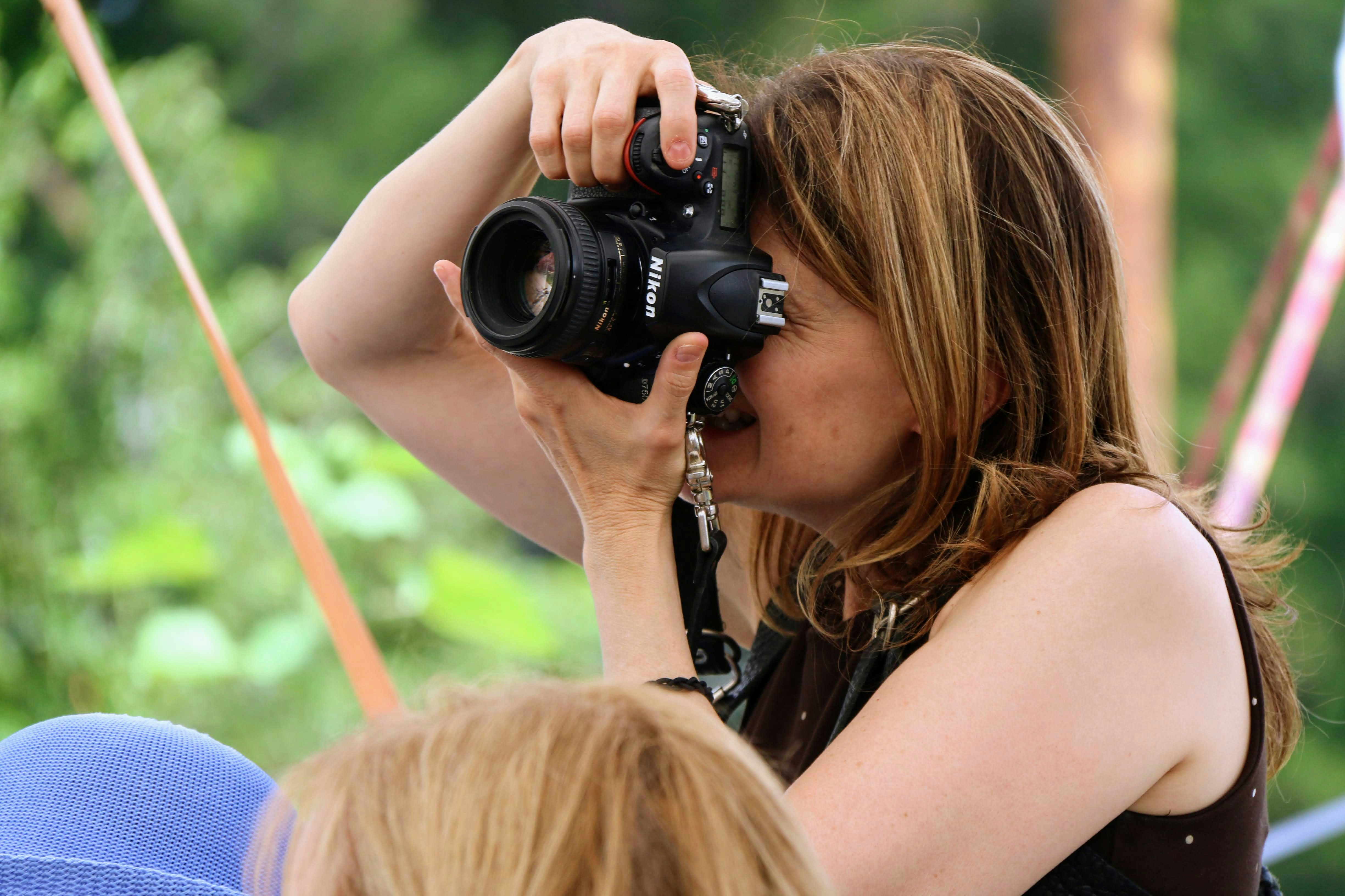 a woman holding a camera