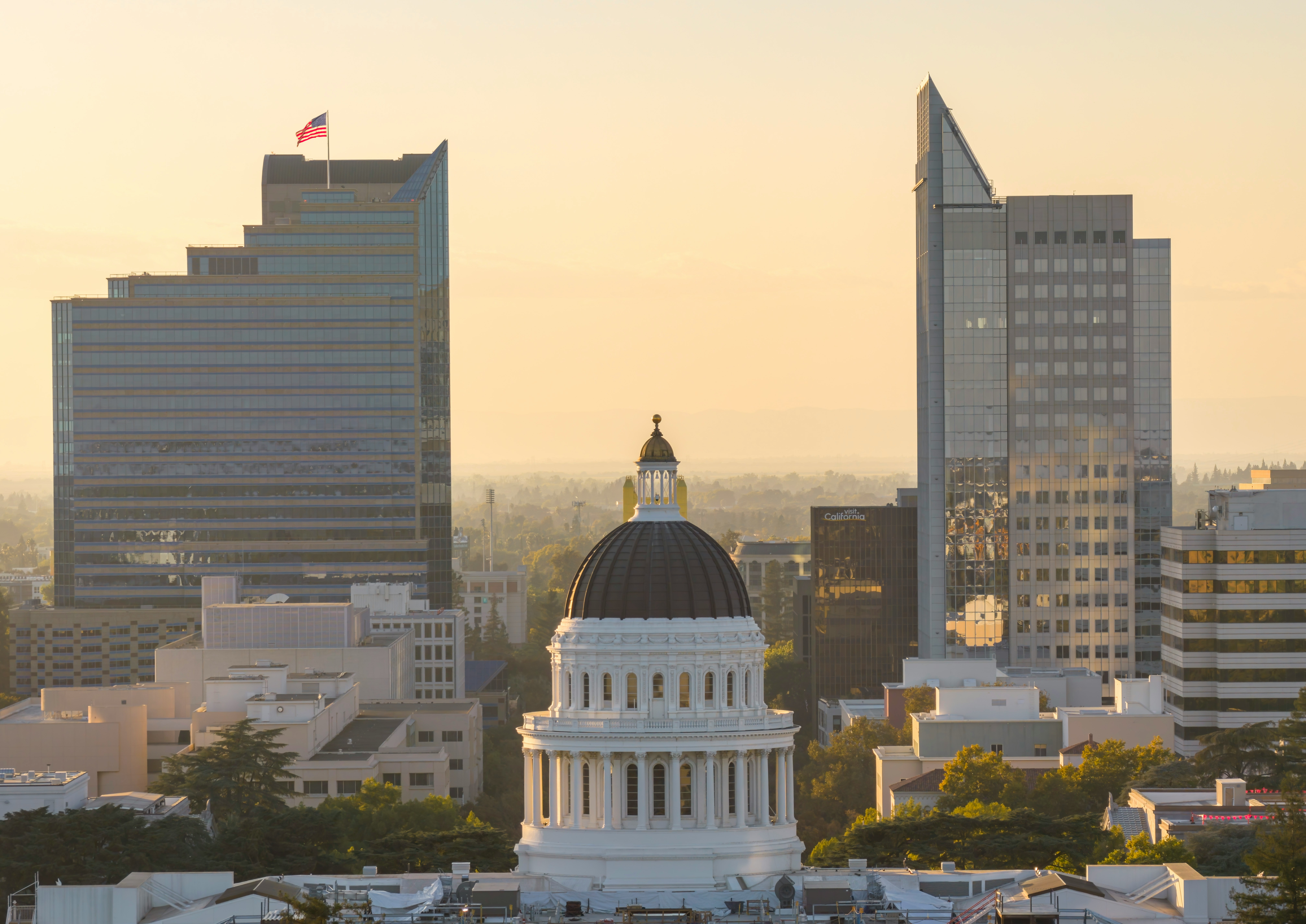 California state capitol building with modern skyscrapers