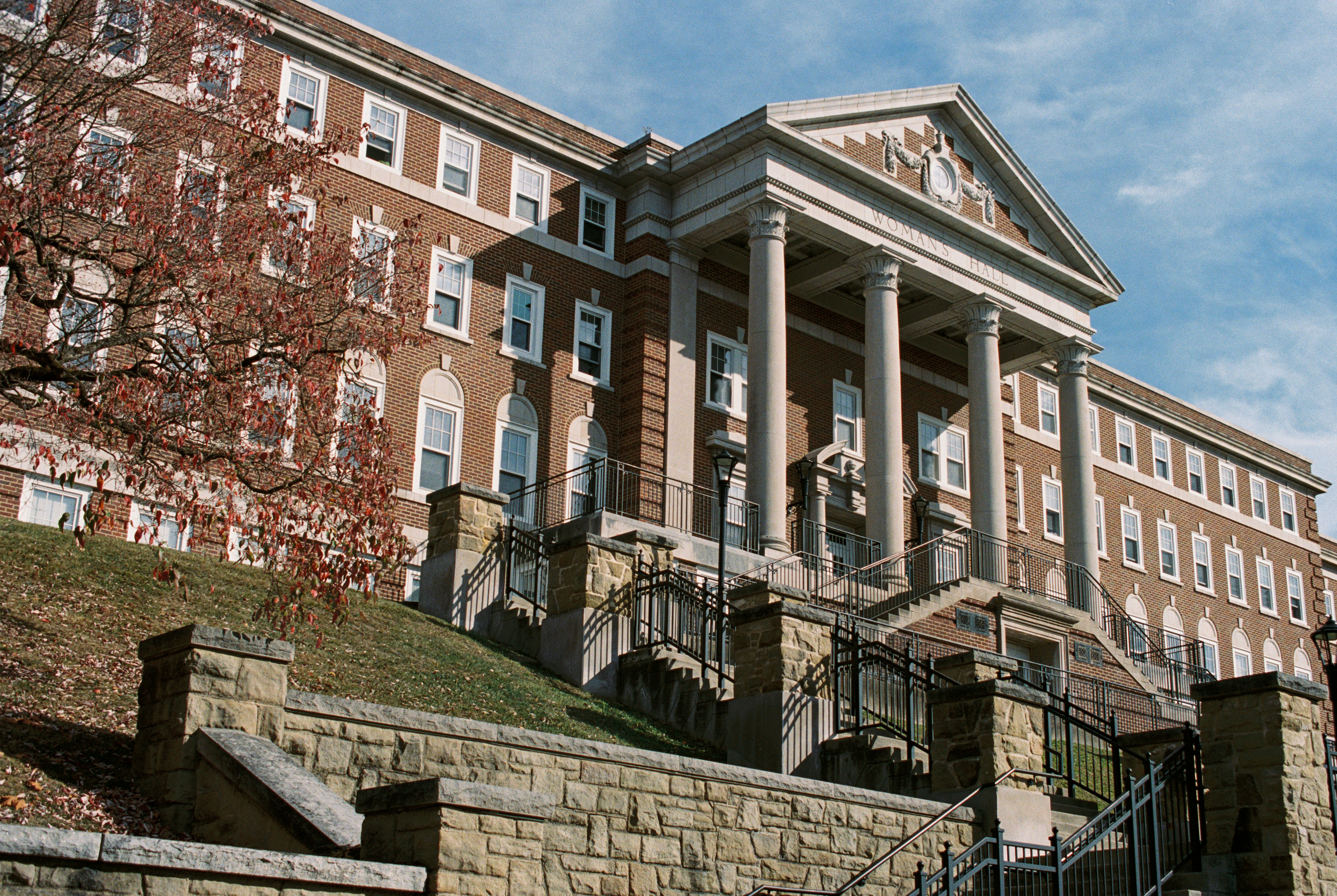A large brick building with a clock on the front of it